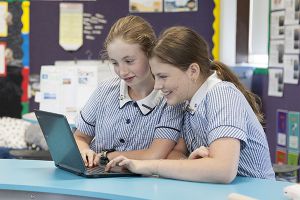 McAuley Catholic Primary School Rose Bay students looking at laptop